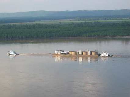 Barge heading upstream on the Mississippi as seen from Trail of Tears State Park