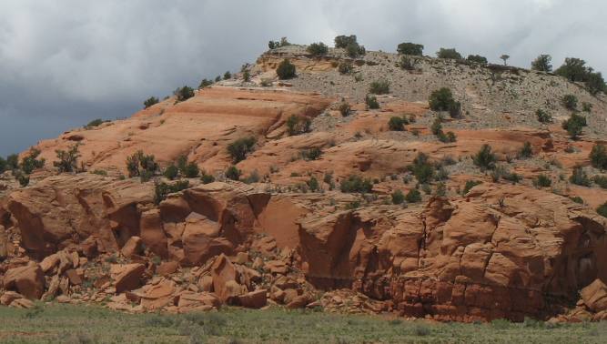 Volcanic ash deposited on top of much older sandstone