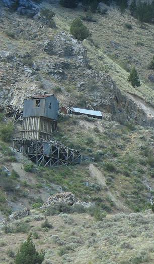Mine shaft and tailings visible from I-84 southeast of Baker City