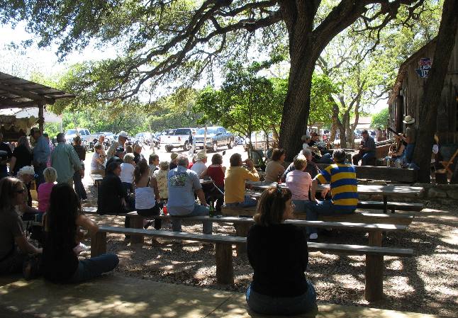 Joyce Hendrix listening to perfromers at Luckenbach