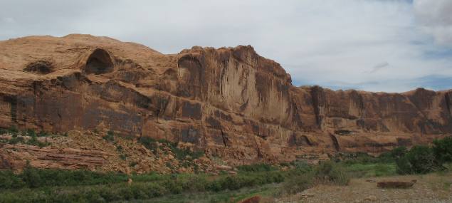 Steep sandstone bluff cut by Colorado River