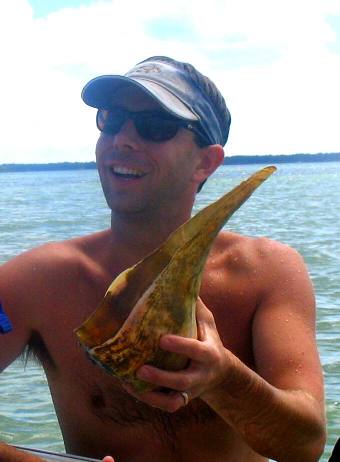 Stephen Hendrix with Whelk shell on St Joe Bay