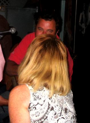 Joyce Hendrix bantering with Vince Gill at the Blue Bird Cafe