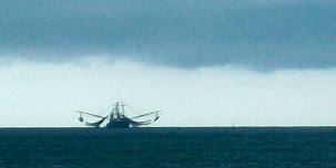 Gulf Shrimper facing angry storm clouds