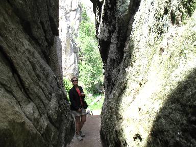 Macklyn Fairchild posing with graninte spires at Sylvan Lake