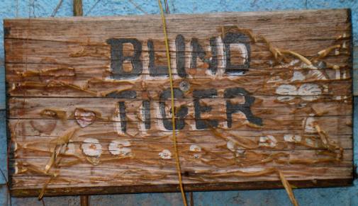 Blind Tiger headstone in Rooster Cemetary at Blue Heaven Restaurant