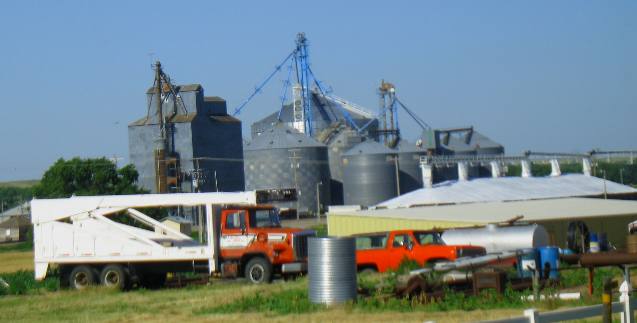 Grain elevators and farm equipment along Scenic US-6 Nebraska