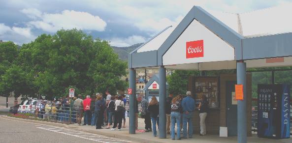 Line waiting for the bus ride from the parking area entrance for Coors Brewery Tour