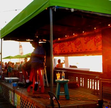 Local talent entertaining Sunset Pier guests on stage at Ocean Key Resorts Sunset Pier