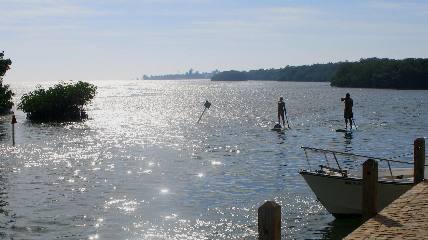 Paddle boarders nearing Geiger Key Marina & Smokehouse Restaurant
