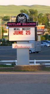 Sign advertising the Neal McCoy Concert at the Outlaw Saloon in Cheyenne, Wyoming