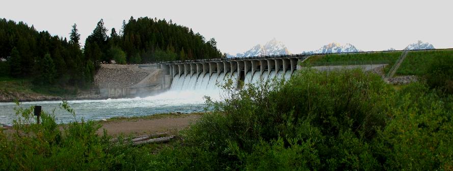 Jackson Lake Dam and spillway with Grand Teton Peak in the in the Teton Range visible over the dam