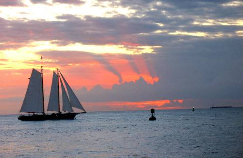 America 2 sailing schooner sailing into the sunset off Key West, Florida in 2012
