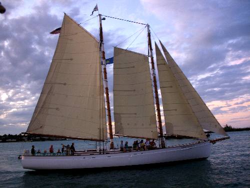 Sailing Schooner Adirondack III passing by Sunset Pier at Ocean Key Resort in Key West during a sunset cruise