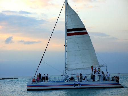 Catamaran from the Fury fleet passing Sunset Pier