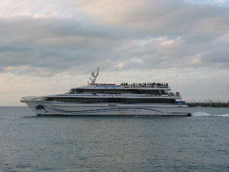 Key West Express as it passes Sunset Pier and Sunset Key in Key West