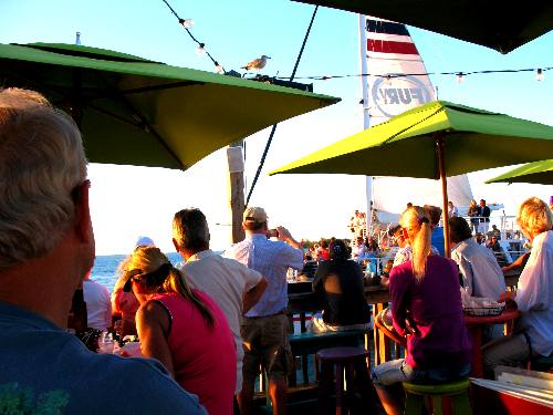 Crowd on Sunset Pier waiting for the sunset while watching the boats parade by