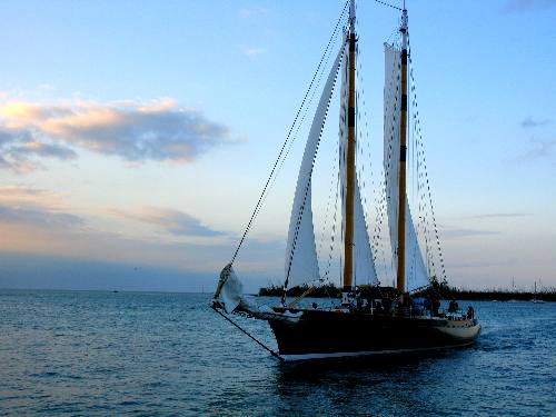 America 2 sailing schooner passing Sunset Pier in Key West with Christmas Tree Island in the background