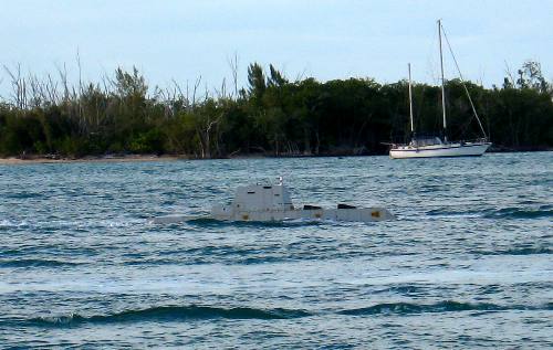 Minature submarine visible from Sunset Pier in Key West as the small submarine passes by Wisteria Island
