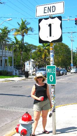 Joyce Hendrix posing at the beginning and end of US-1 on Whitehead Street in Key West