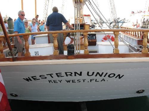 Old Sailing Schooner Western Union loading for a sunset cruise along Harbor Walk at Key West Bight Marina