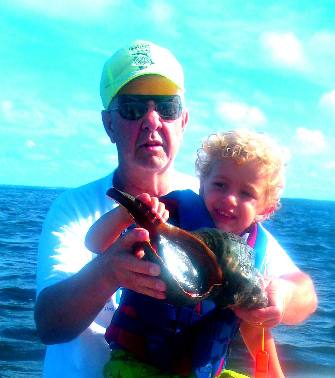 Mike & Bennett Hendrix with large live whelk St Joe Bay