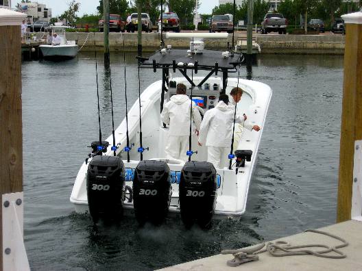 King tournament boat pulling away from dock after weighing fish